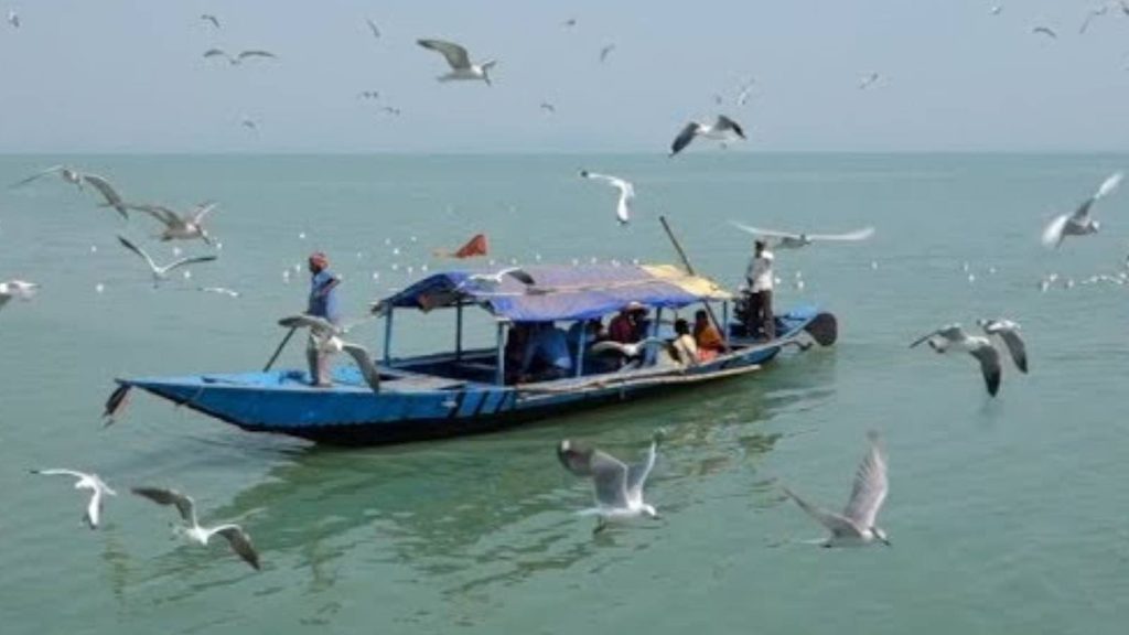 Boat on Chilika Lake surrounded by the peaceful Odisha landscape